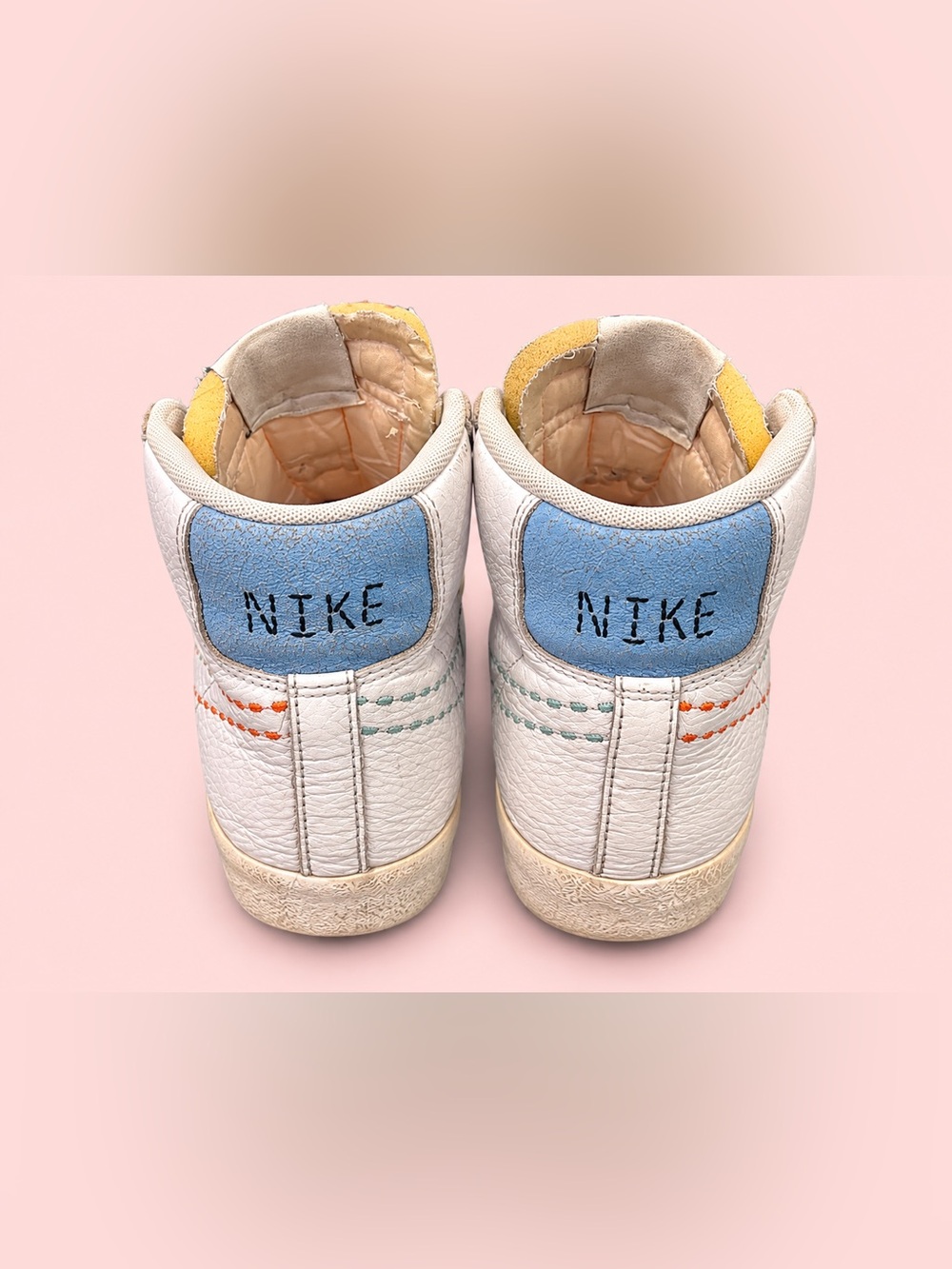 Nike Kids White Leather High-Tops with Blue and Yellow Accents